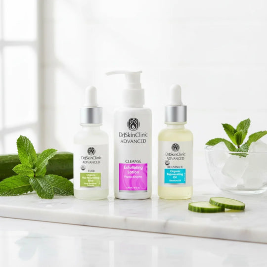 DrSkinClinic Advanced Body Renewal Trio featuring Organic Hair Nourishing Elixir, Exfoliating Lotion with Papaya Enzyme, and Organic Rejuvenating Oil displayed on a marble surface with fresh botanicals.