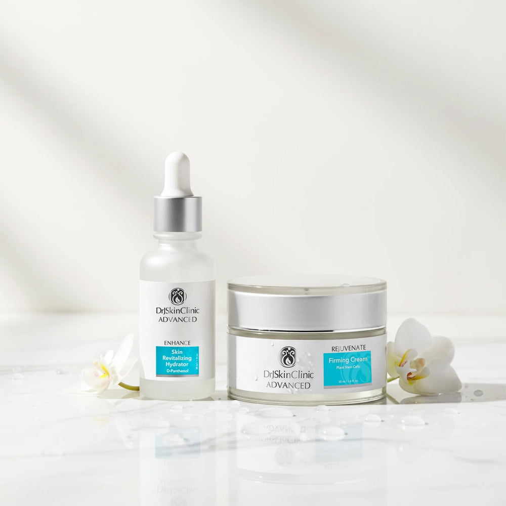 DrSkinClinic Advanced Firm + Hydrate Duo featuring Skin Revitalizing Hydrator and Rejuvenate Firming Cream displayed with white flowers and water droplets.