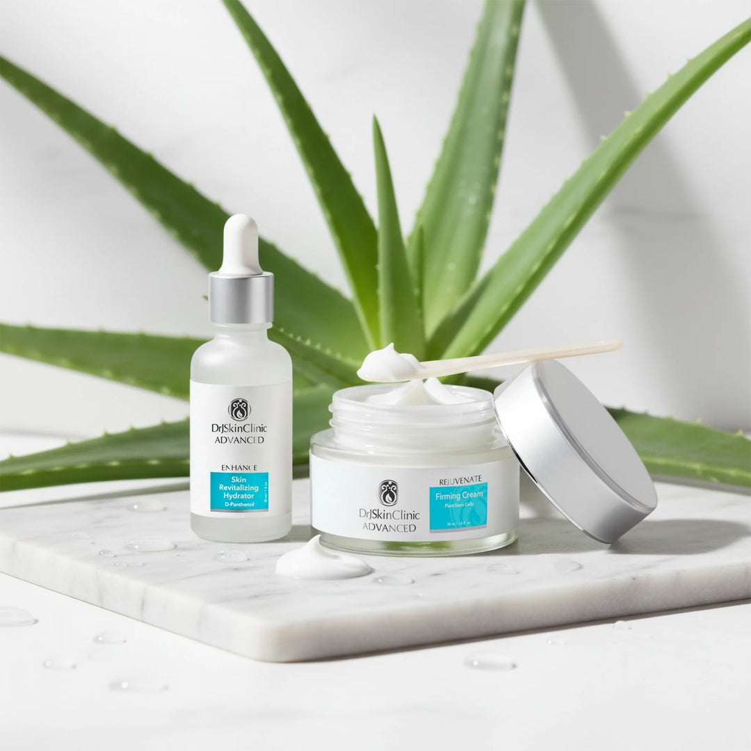 DrSkinClinic Advanced Firm + Hydrate Duo featuring Skin Revitalizing Hydrator and Rejuvenate Firming Cream displayed with aloe leaves and cream texture on a marble surface.