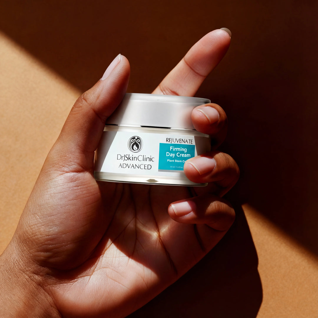 Hand holding a jar of Dr. Skin Clinic Advanced Firming Day Cream against a brown background
