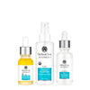 Three Dr. Skin Clinic Advanced products—Rejuvenating Eye Repair Serum, Organic Facial Elixir toner, and Skin Revitalizing Hydrator—arranged as The Radiance Renewal Trio skincare set.
